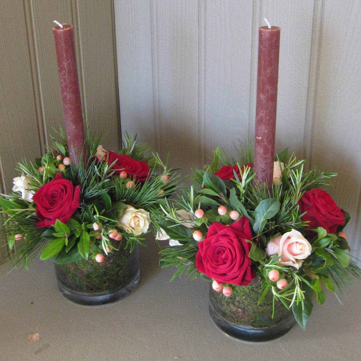 Christmas table centers in glass tank vase.